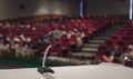 Microphone on the table in conference hall or seminar Royalty Free Stock Photo