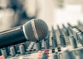 Microphone voice speaker on audio synthesiser electronic music instrument sound mixer machine in broadcasting studio room, seminar Royalty Free Stock Photo