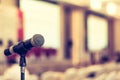 Microphone voice speaker in business seminar, speech presentation, town hall meeting, lecture hall or conference room Royalty Free Stock Photo