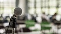 Microphone voice speaker in business seminar, speech presentation, town hall meeting, lecture hall or conference room Royalty Free Stock Photo