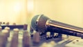 Microphone voice speaker on karaoke or audio synthesiser electronic music instrument sound mixer in radio broadcasting studio room Royalty Free Stock Photo