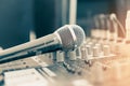 Microphone voice speaker on karaoke or audio synthesiser electronic music instrument sound mixer in radio broadcasting studio Royalty Free Stock Photo