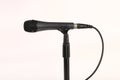 Microphone with wire on a white back ground Royalty Free Stock Photo