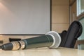 Microphone on wood desk in meeting room under window light