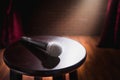 Microphone on a wood stool on a stage Royalty Free Stock Photo