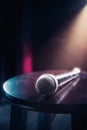 Microphone on a wood stool on a stage Royalty Free Stock Photo