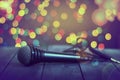 Microphone on a wooden table. Concept music, karaoke,