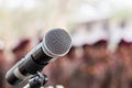 Microphones on abstract blurred of speech in seminar room, speaking conference hall light for presentation in exhibition event Royalty Free Stock Photo