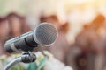 Microphones on abstract blurred of speech in seminar room, speaking conference hall light for presentation in exhibition event Royalty Free Stock Photo