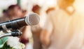 Microphones on abstract blurred of speech in seminar room, speaking conference hall light for presentation in scout camp Royalty Free Stock Photo