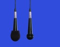 Microphones hanging side by side Royalty Free Stock Photo
