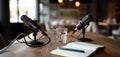 The microphones ready for an engaging podcast conversation at a cozy workspace. AI generated image Royalty Free Stock Photo