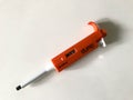Micropipette used to transfer sample on white background