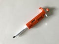 Micropipette used to transfer sample on white background
