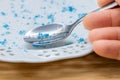 Microplastic in food, Environment and health concept, spoon and plate with plastic particles, Effect of environmental pollution on Royalty Free Stock Photo