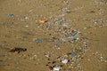 Microplastics pollution of the ocean, polluted beach.