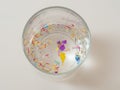 Microplastics in a glass of water water - polluted water concept Royalty Free Stock Photo