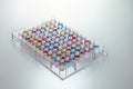 Microplate wells filled with color samples Royalty Free Stock Photo