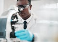 Microscope, black man and chemistry with research, medical and experiment with biotechnology. African person, science