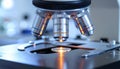 Microscope with Bright Light Exploring Sample in Laboratory Modern Scientific Equipment Royalty Free Stock Photo