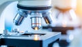 Microscope with Bright Light Illuminating Sample in Laboratory Setting Royalty Free Stock Photo