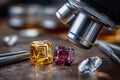 Microscope examining colorful gemstones on wooden table Royalty Free Stock Photo