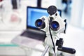 Microscope eyepieces and laptop Royalty Free Stock Photo