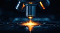 A microscope is focused on a bright orange light, creating a burst of sparks. Royalty Free Stock Photo