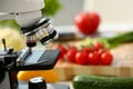 Microscope head on kitchen background Royalty Free Stock Photo
