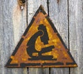 Microscope Icon on Weathered Warning Sign.