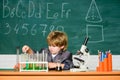 Microscope at lab. student do science experiment with microscope in lab. Back to school. Pupil looking through Royalty Free Stock Photo