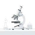 Microscope on Laboratory Table With Test Tubes and Flask Royalty Free Stock Photo