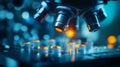 A microscope lens focuses on a sample, illuminating it with a bright light Royalty Free Stock Photo