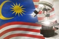 Microscope on Malaysia flag background - science development concept. Research in genetics or biology 3D illustration of object