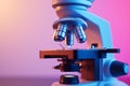 Microscope with metal lens at laboratory. Scientific and healthcare research, examining of test sample in a lab Royalty Free Stock Photo