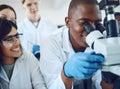 Microscope, science and scientist team with study test for research, medicine innovation and biotechnology in healthcare Royalty Free Stock Photo
