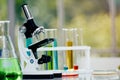 Microscope on table with laboratory equipment in chemical lab Royalty Free Stock Photo