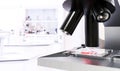 Microscope for tests and medical examinations with bacteriological sample for analysis with unfocused background