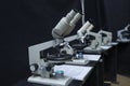 Microscopes set on the worktable of the school lab