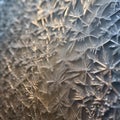 A microscopic view of intricate patterns formed by frost on a window pane during a cold winter morning4