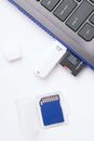 MicroSD memory card, white USB stick plugged in the ports of the laptop Royalty Free Stock Photo
