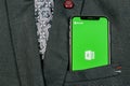 Microsoft Exel application icon on Apple iPhone X screen close-up in jacket pocket. Microsoft office Exel app icon. Microsoft offi