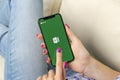 Microsoft Exel application icon on Apple iPhone X screen close-up in woman hands. Microsoft office Exel app icon. Microsoft offic