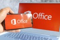 Microsoft Office logo on computer screen and Microsoft Office logo is seen on mobile phone screen Royalty Free Stock Photo