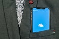 Microsoft OneDrive application icon on Apple iPhone X screen close-up in jacket pocket. Microsoft onedrive app icon. Microsoft off Royalty Free Stock Photo