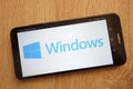 Microsoft Windows logo displayed on a modern Huawei smartphone