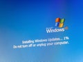 Microsoft Windows XP operating system update, installing updates one percent progress, do not turn off or unplug your computer OS