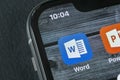 Microsoft word application icon on Apple iPhone X screen close-up. Microsoft office word icon. Microsoft office on mobile phone.