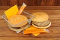 Microwave beefburgers on a wooden background Royalty Free Stock Photo