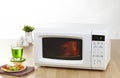 Microwave the home appliance isolated in the kitchen interior Royalty Free Stock Photo